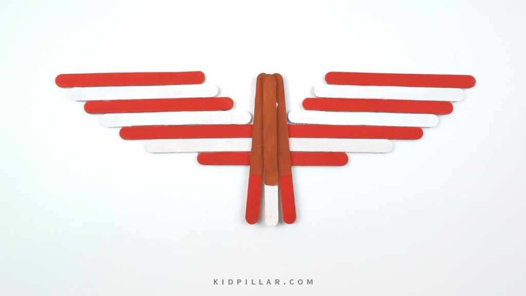 Paste brown popsicle sticks to make the body of the bald eagle craft