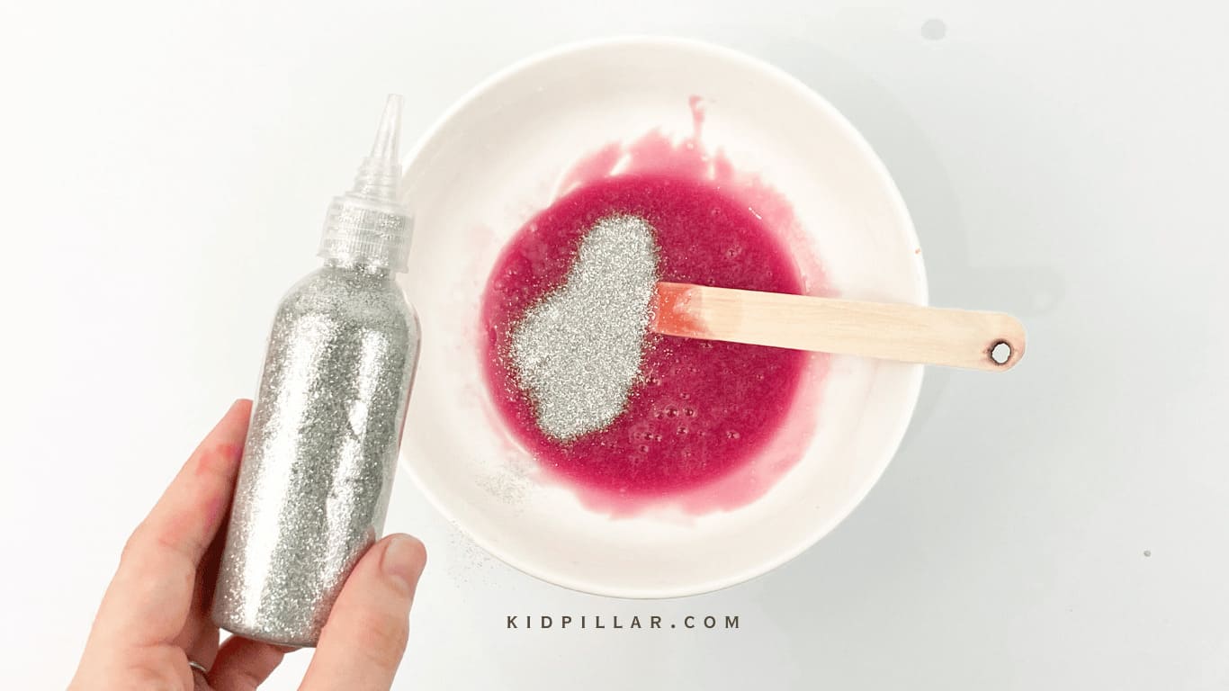 Add glitter to unicorn slime glue mixture