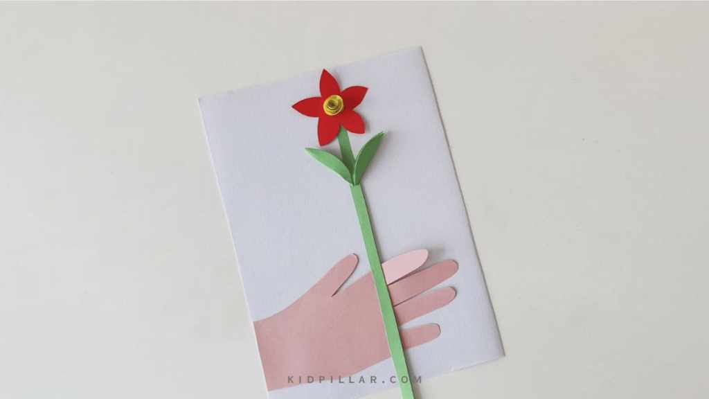 Arrange paper flower on DIY mother's day paper flowers card