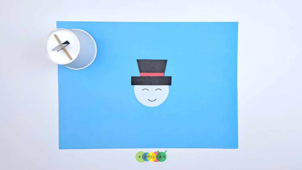 Paste the hat on the face of diy moving snowman craft with paper cup