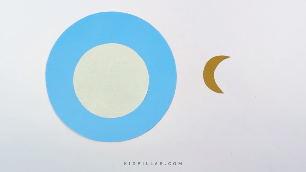 Cut mother moon and baby crescent moon from paper