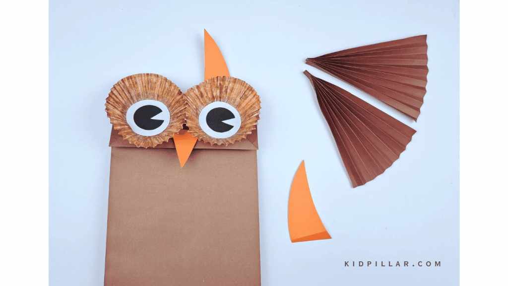 Paste the beak & ears on owl paper bag craft