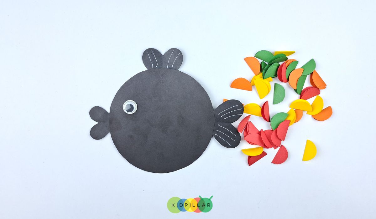 Making easy paper rainbow fish craft preschoolers