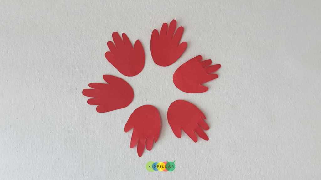 Cut out the template for easy poinsettia craft for preschoolers