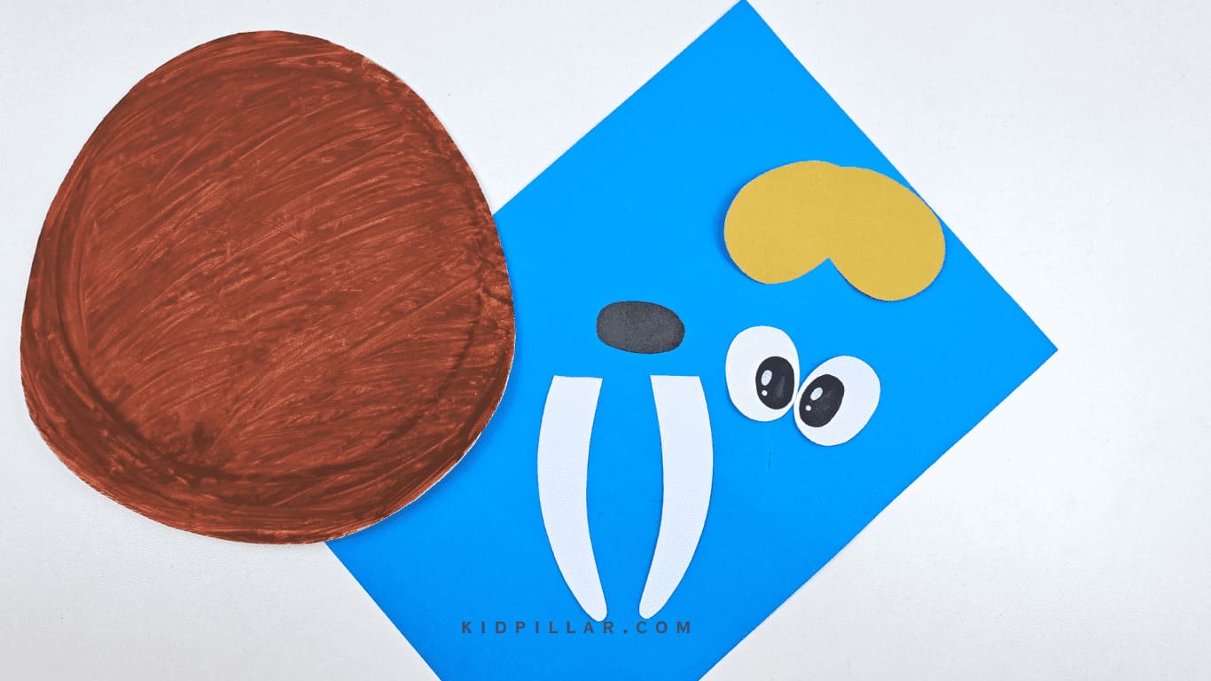 Make facial features of easy walrus paper plate craft 