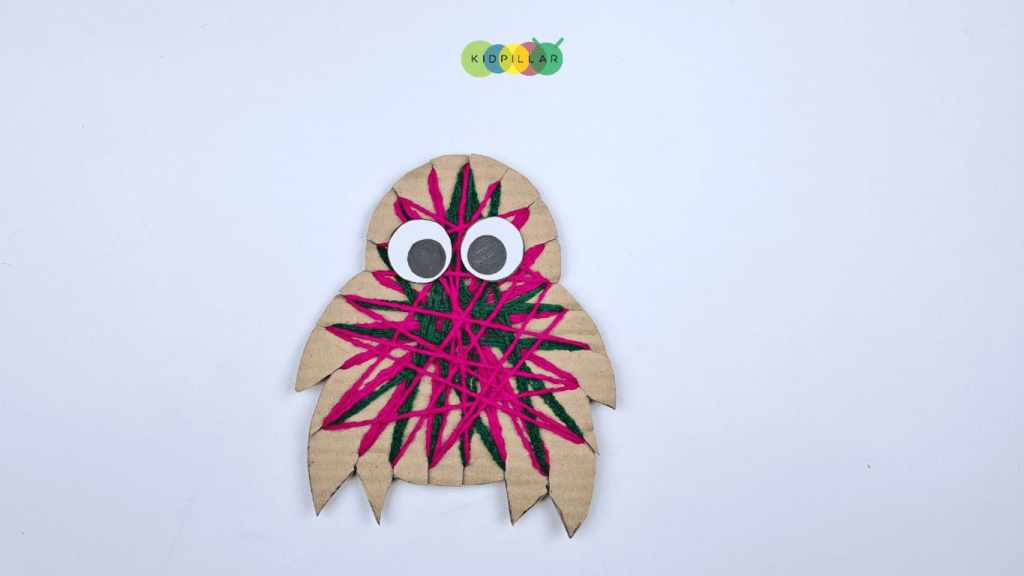 Make eyes of Easy yarn wrapped love monster craft