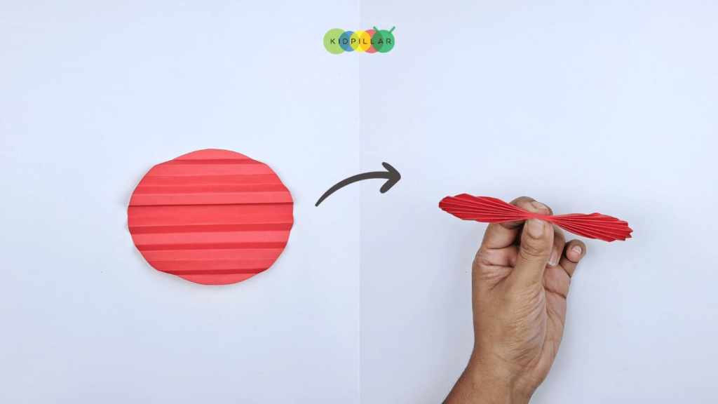 Pinch the accordion folds to make heart ladybug valentine craft for kids