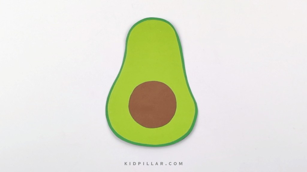 Cut a brown circle to make pit of avocado and paste it on paper avocado craft