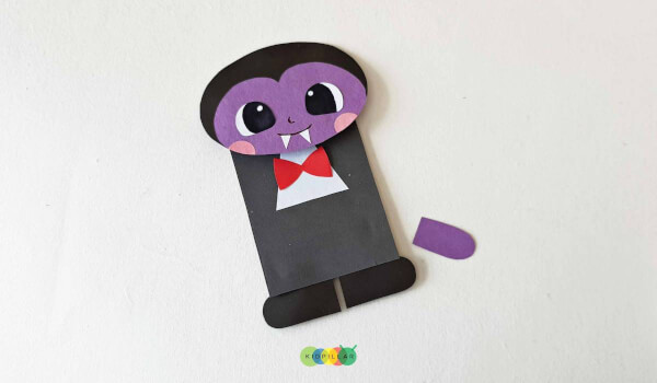 add bow tie to paper bag puppet vampire craft