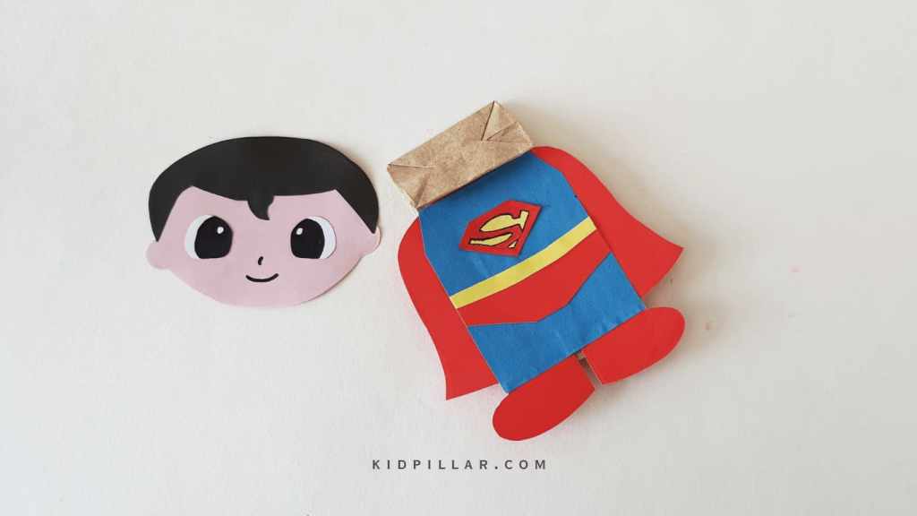 Glue the body of superman on Paper bag 