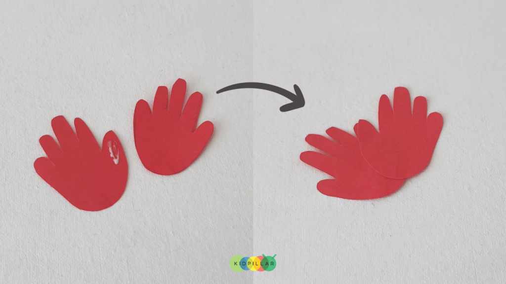 Glue the handprints of poinsettia craft idea