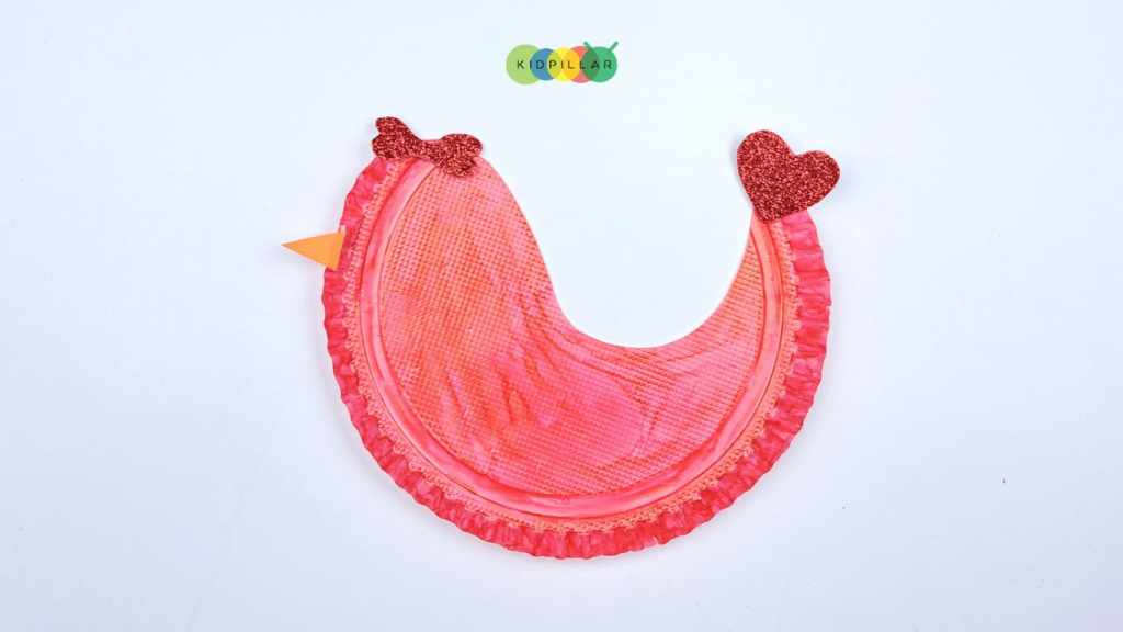 Glue bow and tail on rocking love birds valentine craft