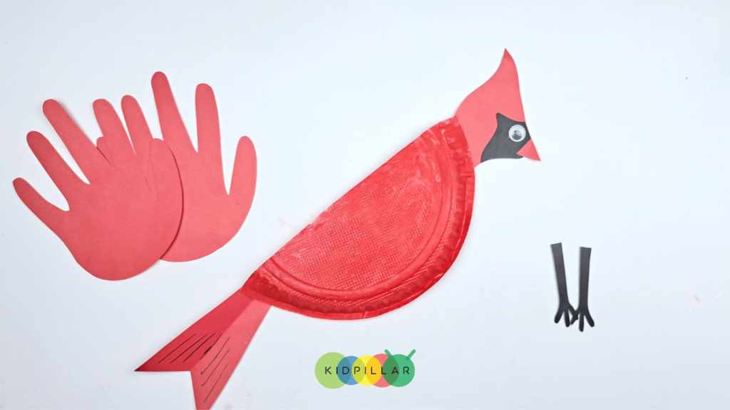 Paste the tail and neck of simple cardinal winter craft on paper plate body