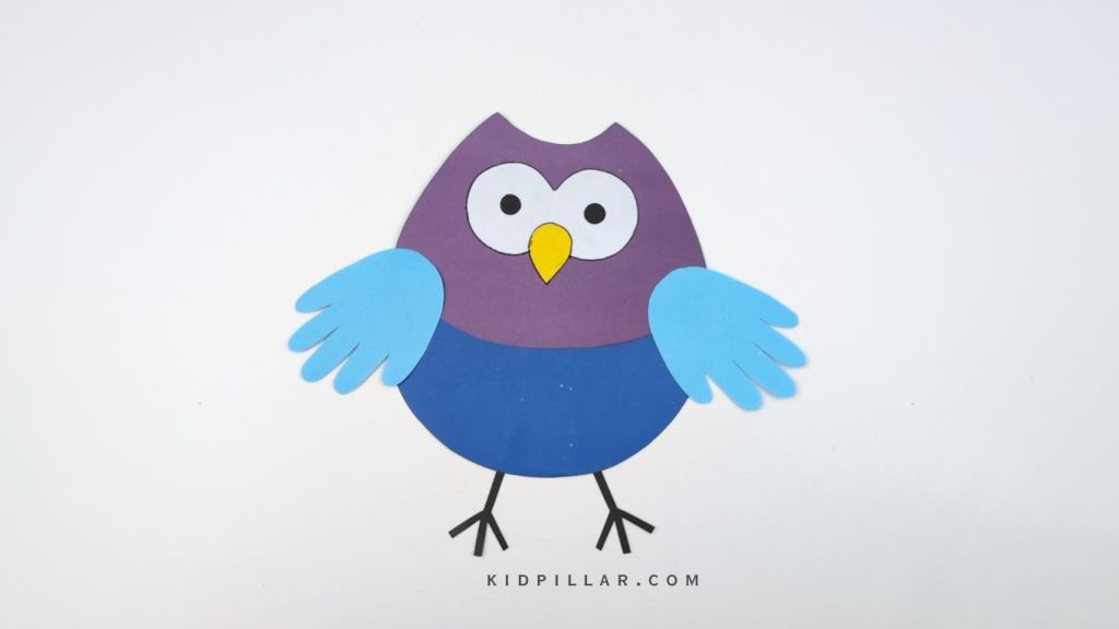 Glue the legs of Simple owl handprint craft for kids