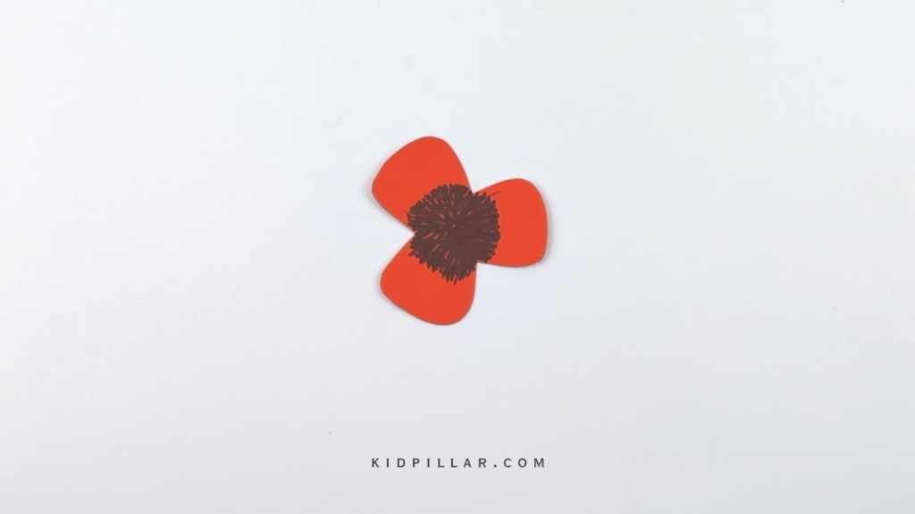 Use black pen to colour the enter of the poppy flower cutout