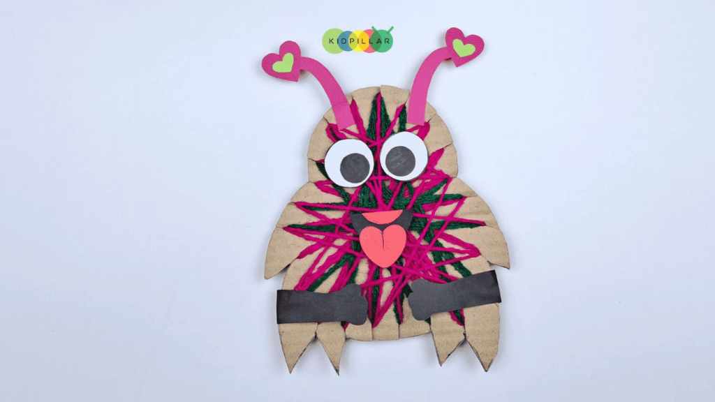 Glue hands on yarn wrapped love monster craft